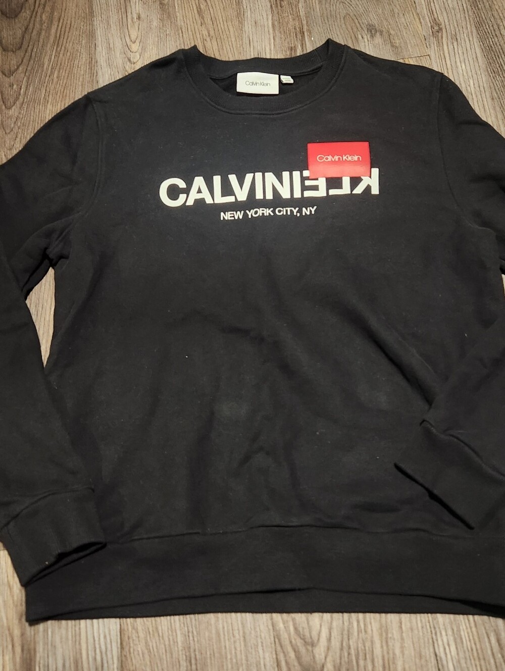 Calvin Klein Black Crewneck Sweatshirt with White Logo and Red Patch